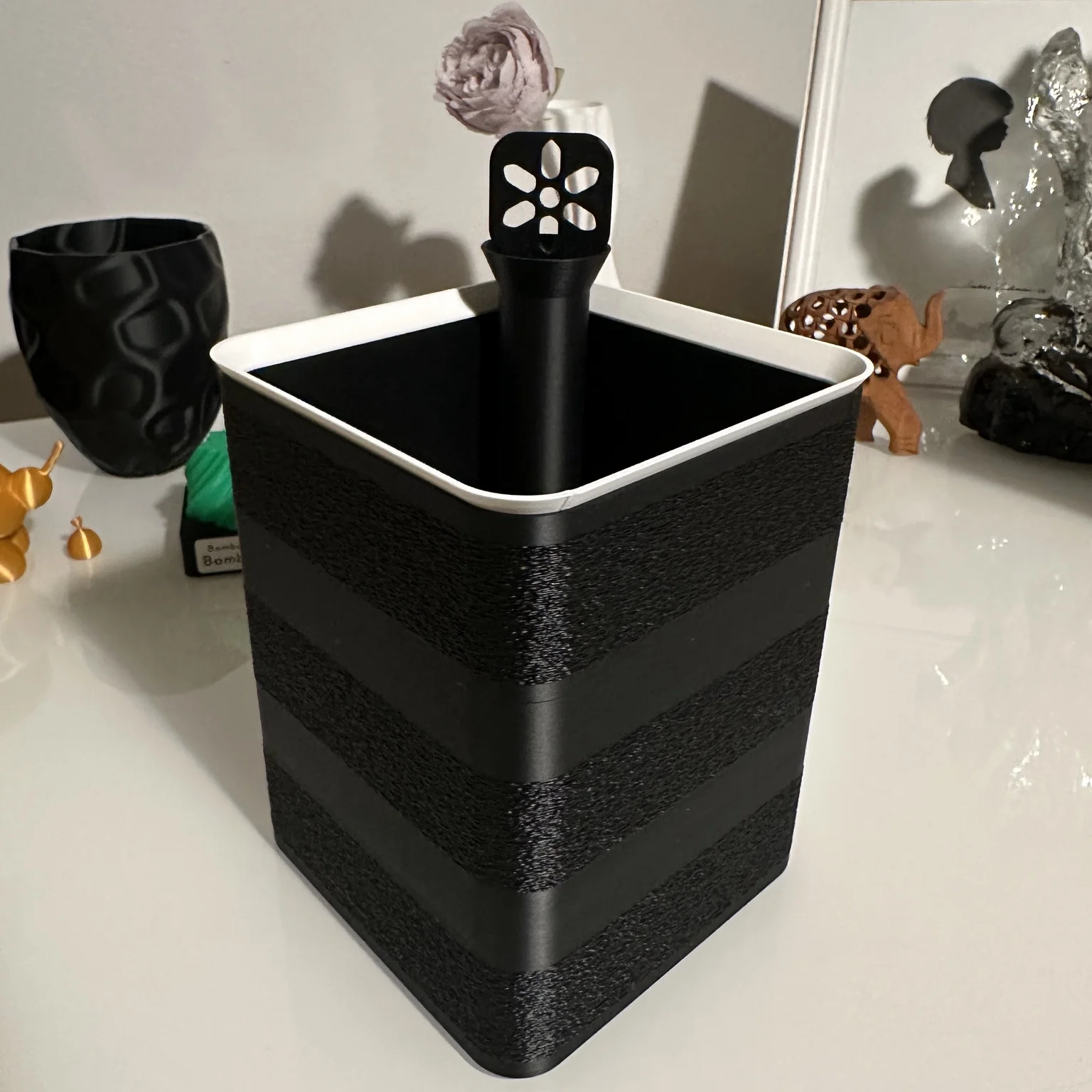 Black square modular semi-hydroponic plant pot with a white-rimmed inner container and removable watering tube