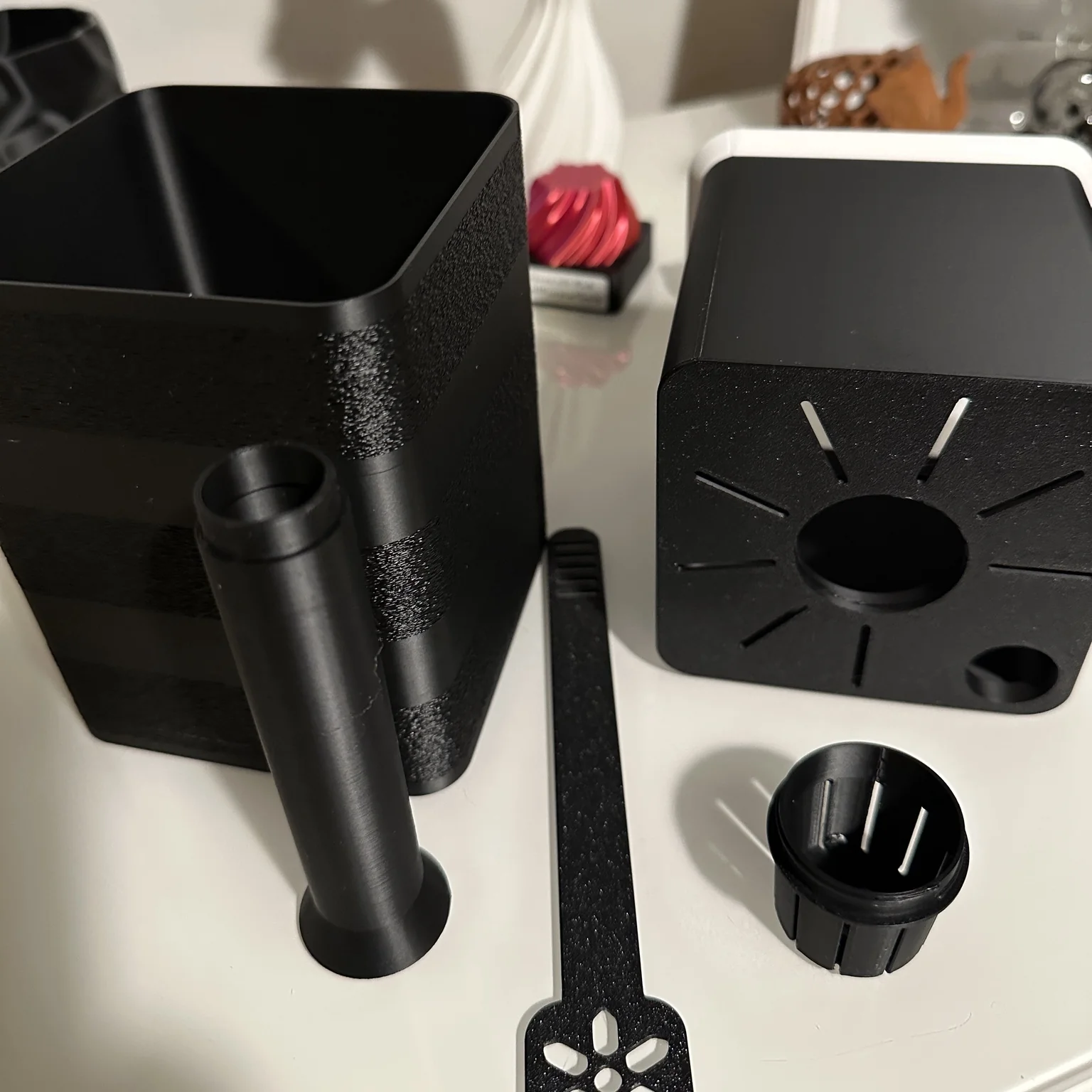 The modular pot's five components laid out separately to show the removable parts